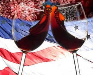 Two wine glasses clinking with an American flag in the background